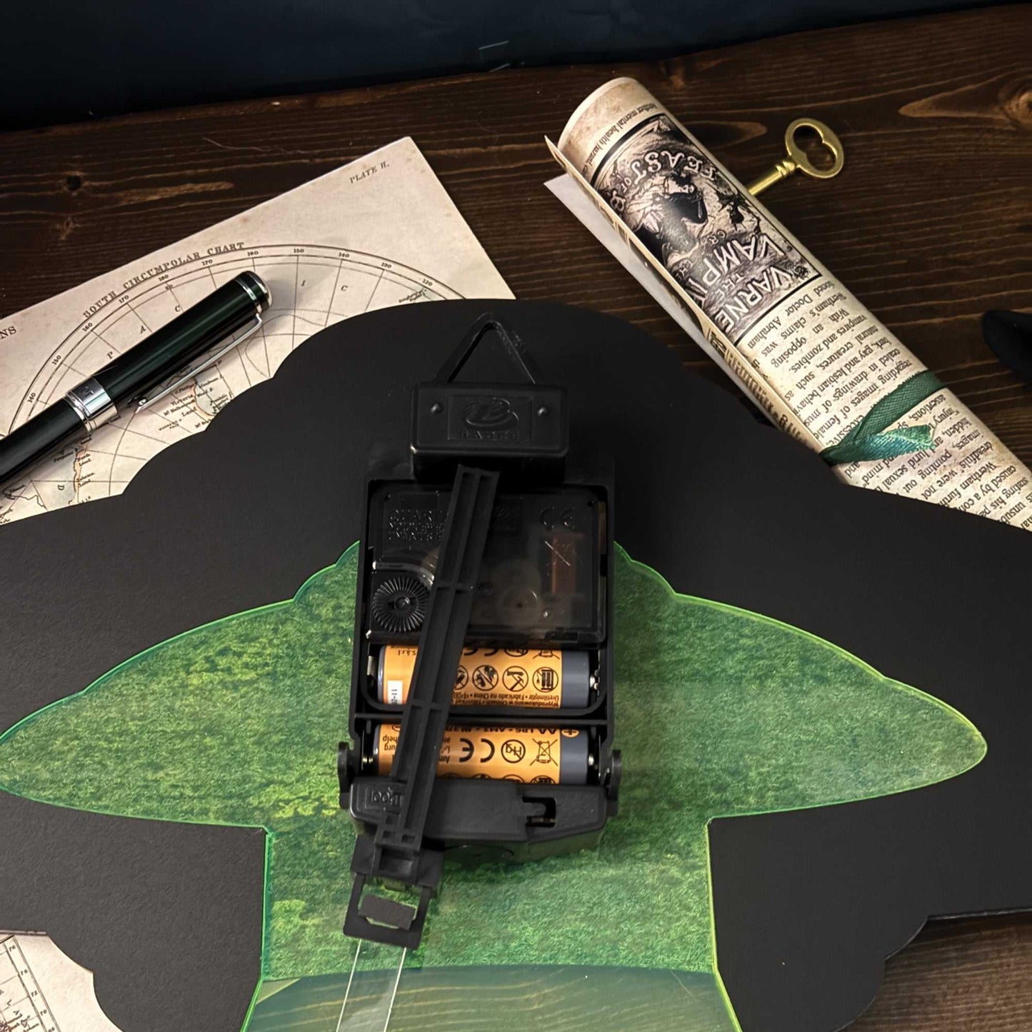 Clock mechanism on the back of a UFO shaped clock