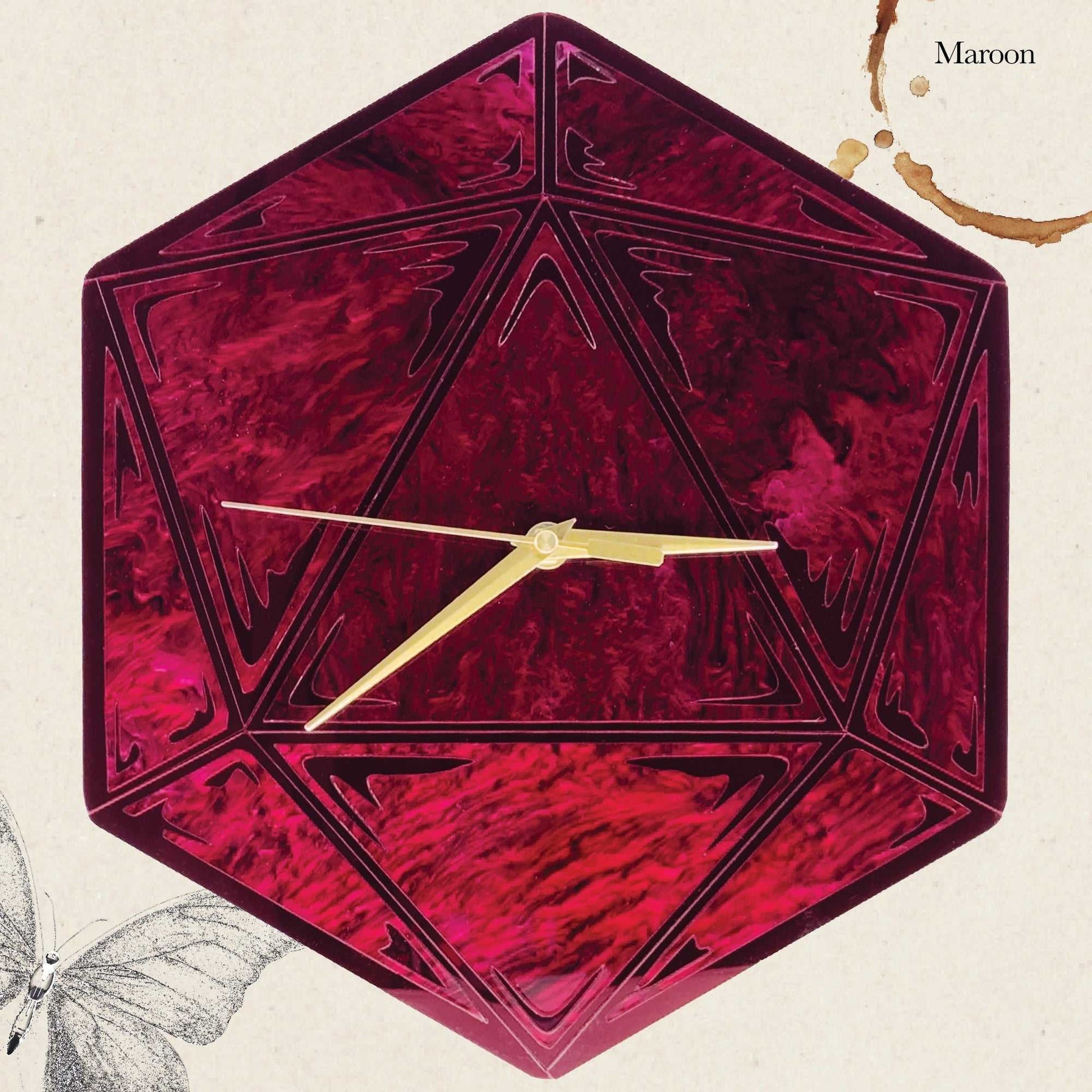 Hexagonal maroon clock with gold hands on a beige background