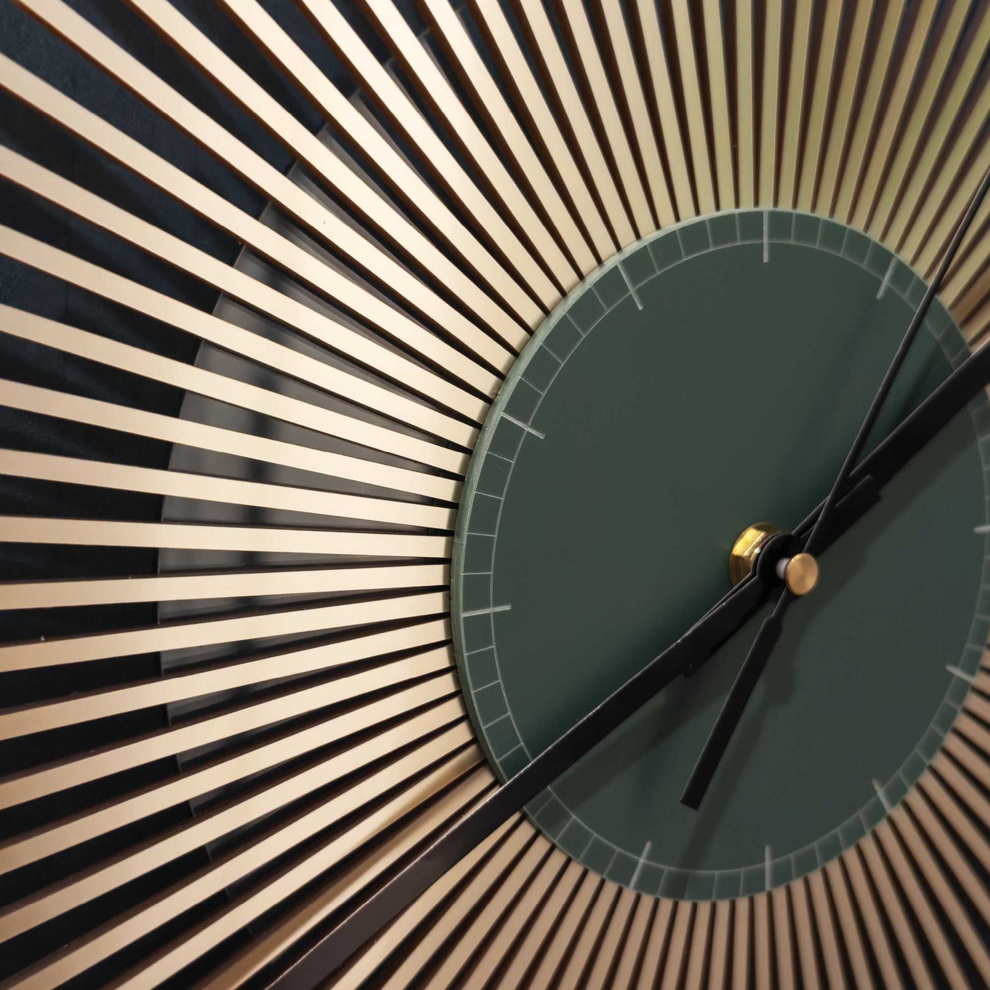 Wall clock with green face and black hour hand, set against a sunburst pattern.