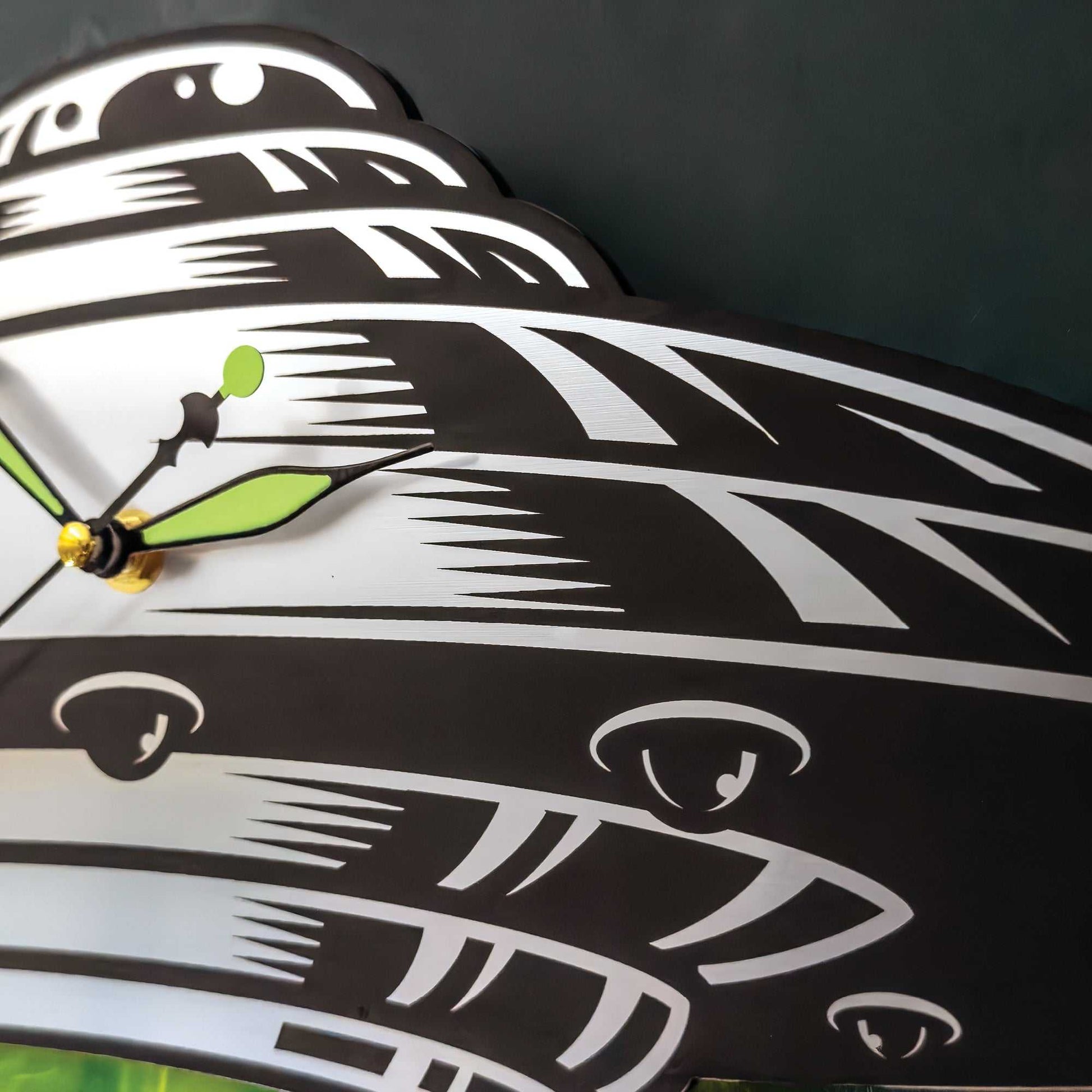 Decorative wall clock with artistic design on a dark background