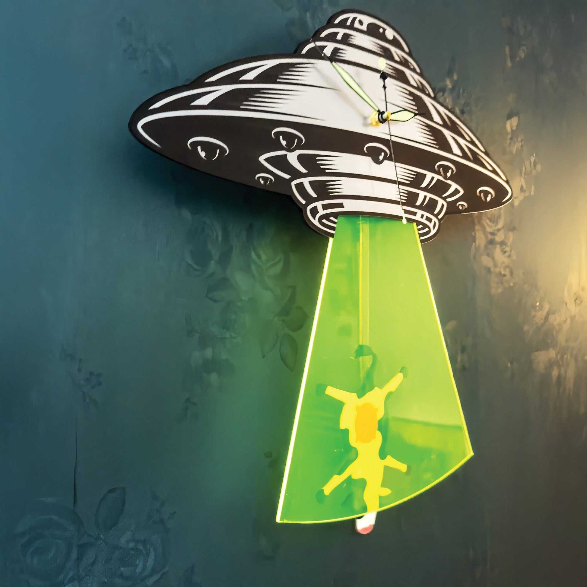 UFO clock on a dark wall