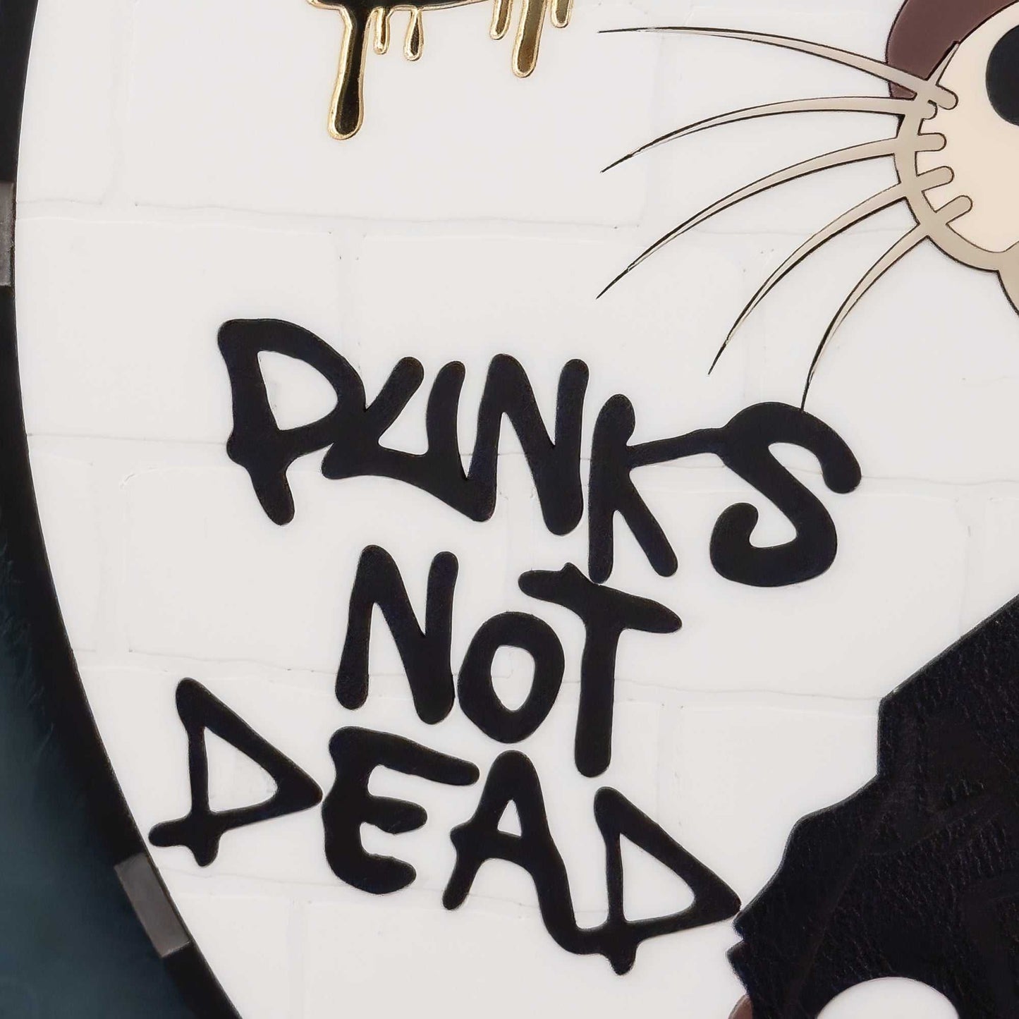 Close up of  'Plunks Not Dead' text and cartoon character on a white background
